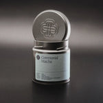 Ceremonial matcha powder in open tin — vibrant green, ultra-fine texture, Slow Social Club