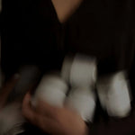 Ceremonial Matcha tin on hand — lifestyle product shot, Slow Social Club Portugal