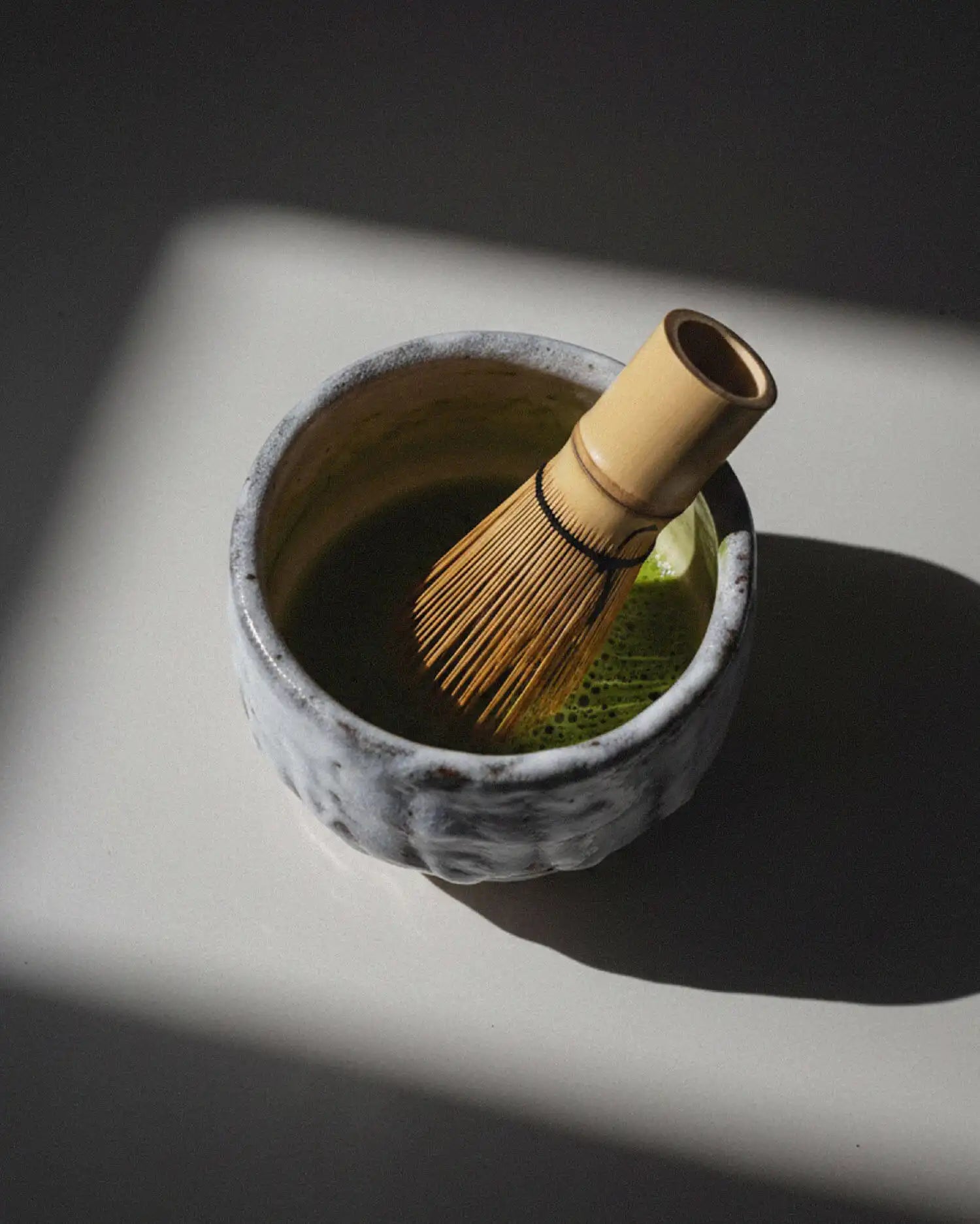 Gifu Chawan lifestyle shot — morning ritual, matcha bowl in hands, Slow Social Club